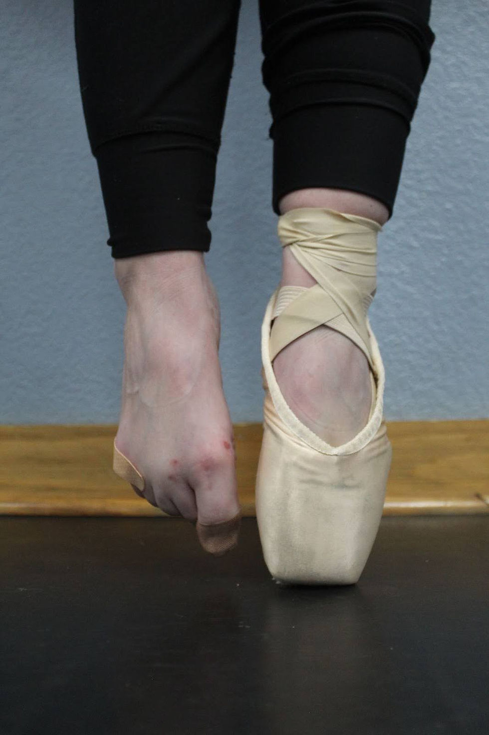 A dancer poses en pointe as she practices ballet. File photo.