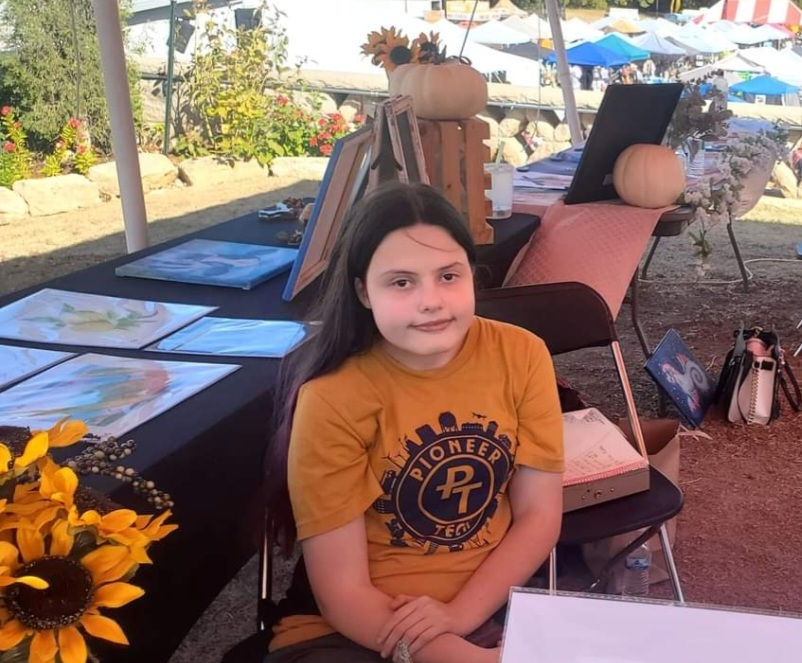 Emma Pena shows off her artwork (Photo Provided)