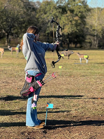 The author practices archery as part of a 4-H program (Photo provided).